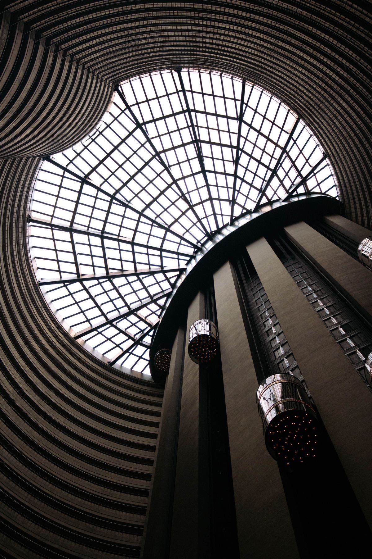 Grand circular skylight above a bank of elevator shafts